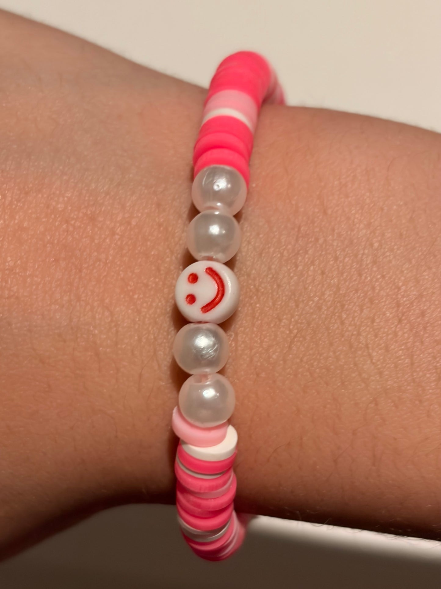 Two set of cute smiley face bracelets (pink and blue)