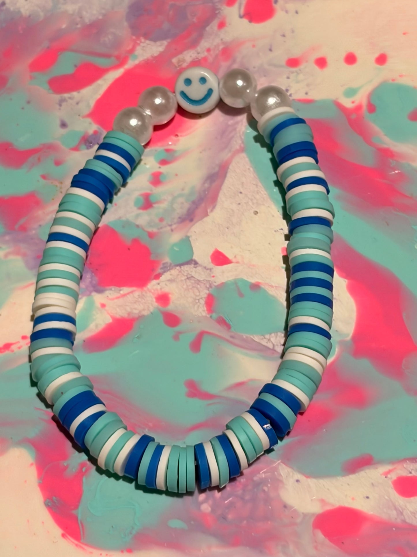 Two set of cute smiley face bracelets (pink and blue)