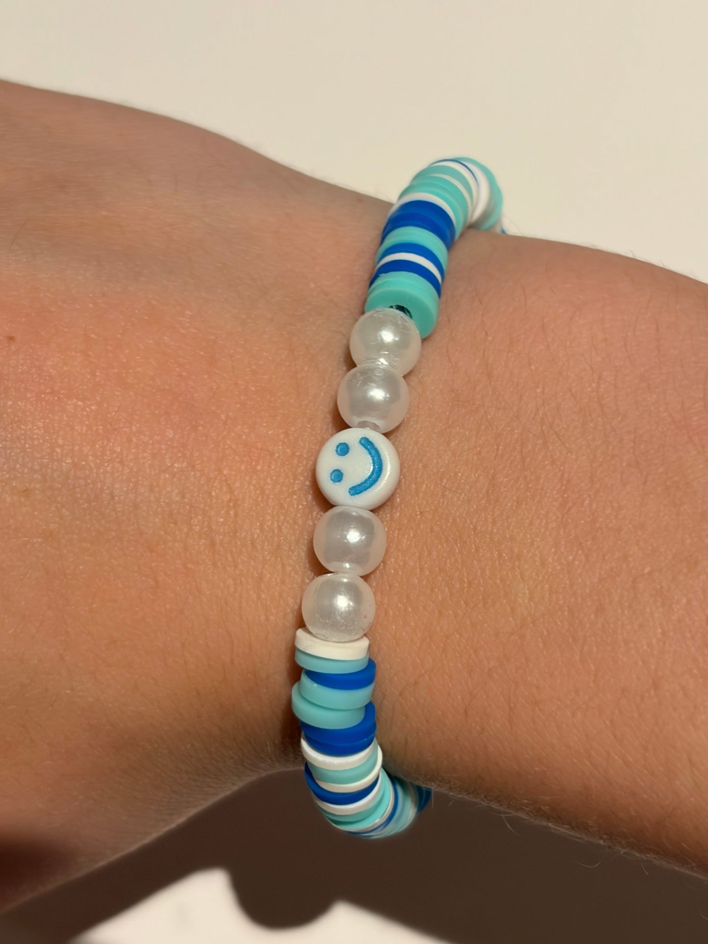 Two set of cute smiley face bracelets (pink and blue)
