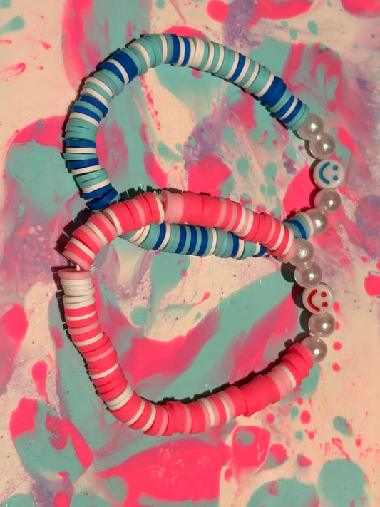 Two set of cute smiley face bracelets (pink and blue)